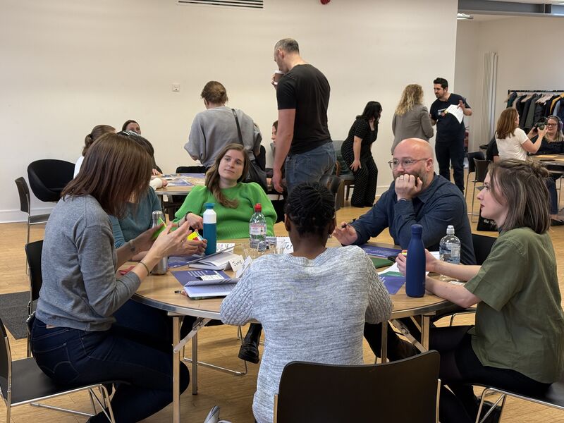 A group of people engaging with some of the AllyShip props