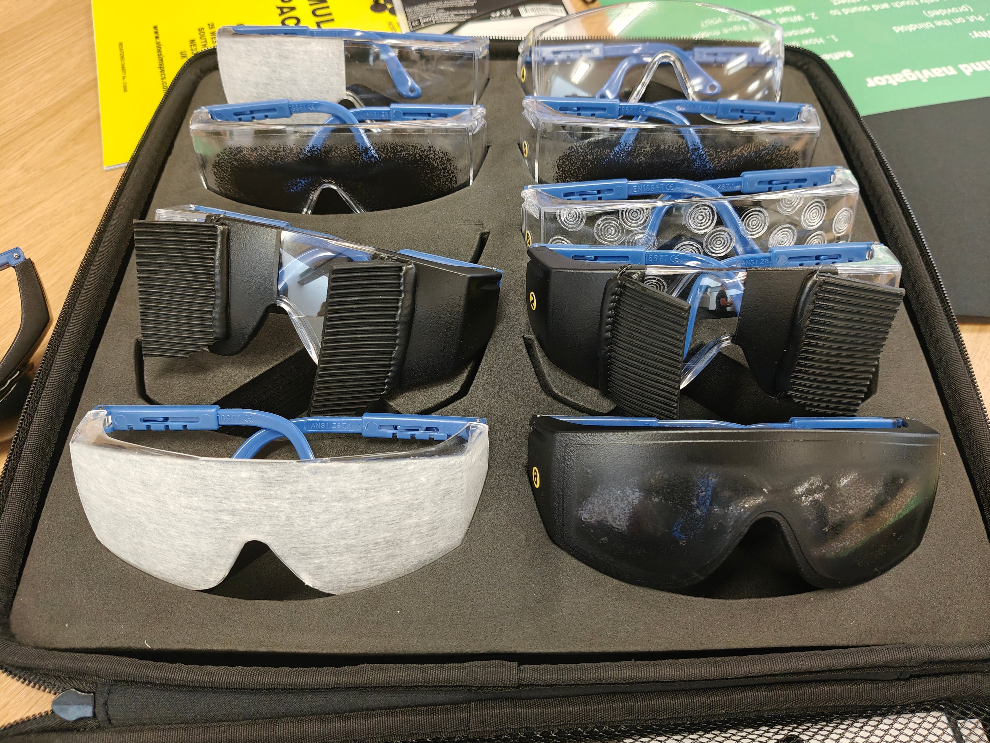 Four pairs of vision impairment simulating glasses
